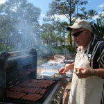 Armand estimated there were 75 hotdogs on the grill at this point.