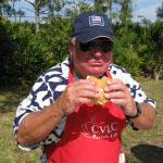 John enjoys the fruit of his labor.